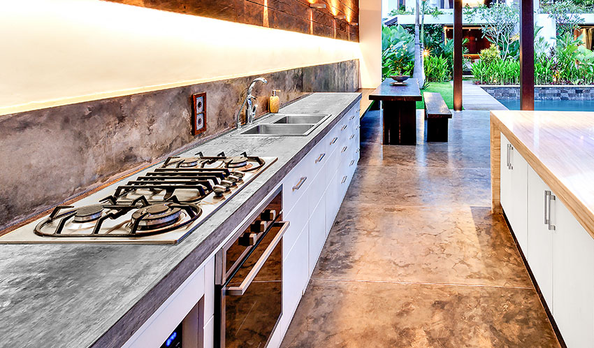 Kitchen with built-in stove and stone countertop